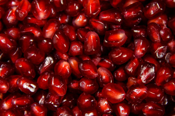 Food background of the fresh ripe pomegranate seeds