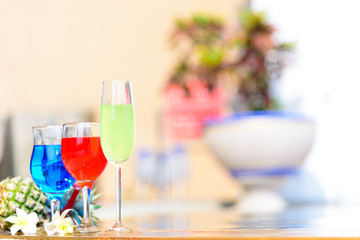 Colorful tropical cocktails at swimming pool with summer vacation holiday concept.