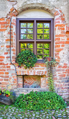 Fototapeta na wymiar New window in an old brick wall
