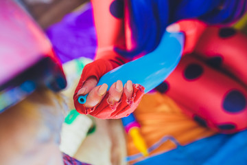 animator for children inflates long balls