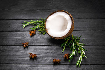 Coconut on a black wooden table.