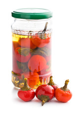 Pickled hot chili peppers. Marinated vegetable.