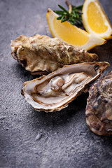 Fresh oysters with lemon and rosemary