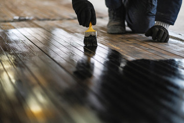 worker paints the metal