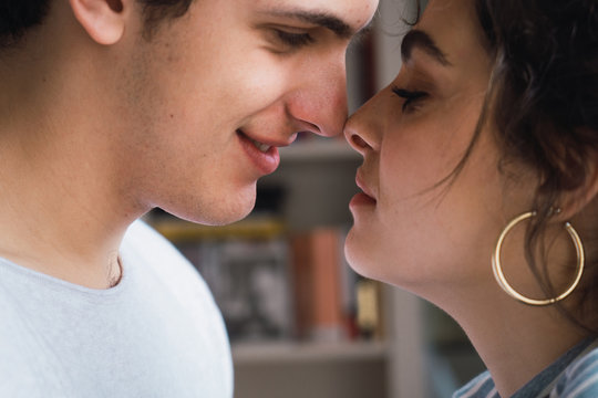 Crop sensual couple at home