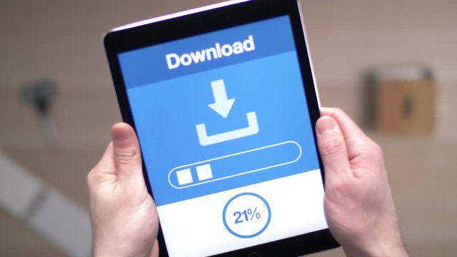 Downloading data on a tablet device.