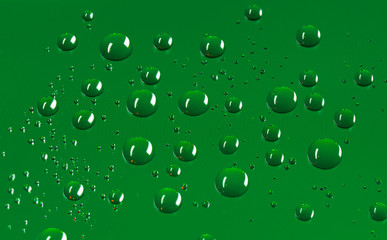 Round water droplets background with a pattern of pixels in a dark green colour.