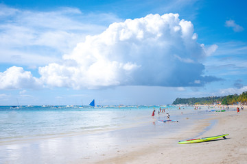 Paddleboard are laying over the ocean in Boracay island white beach, Philippines