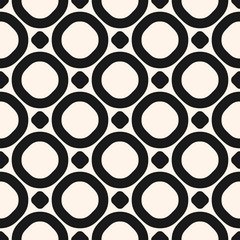 Circles vector seamless pattern. Black and white texture with big rings and dots