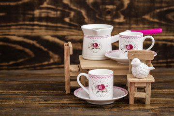 Decorative Colorful Porcelain Coffee set on Wooden Background
