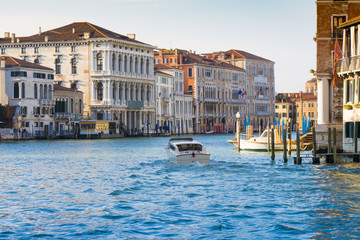 Venice, Italy: a taxi motorboat runs along the Grand Canal