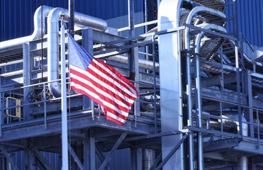 American Flag flying in front of manufacturing factory