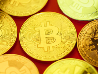 Beautiful Golden bitcoin on red background