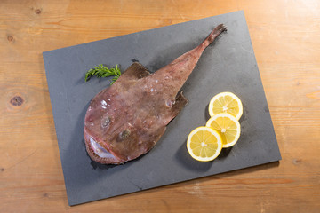 anglerfish presented on a slate