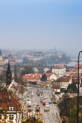 Fototapeta na wymiar Top view of Prague old town streets from the Letna park view point, Charles bridge and Vltava river 