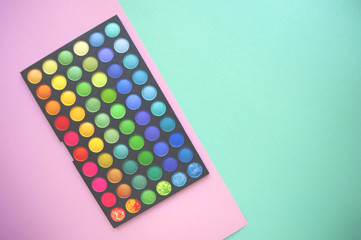 Eyeshadows on colorful background.