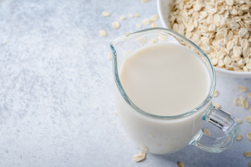 Oat milk on a light blue table