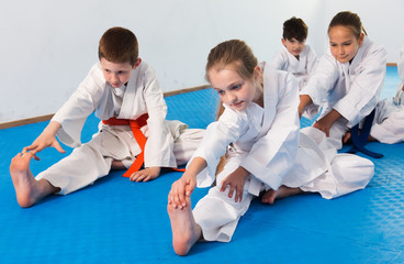 Fototapeta na wymiar Children stretching before karate class