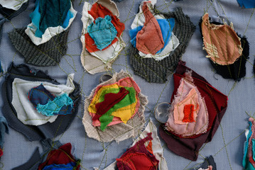 Wedding rings in scraps of fabric of different colors stitched together
