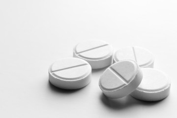 Piles of pills and capsule on white background, isolated. Selective focus