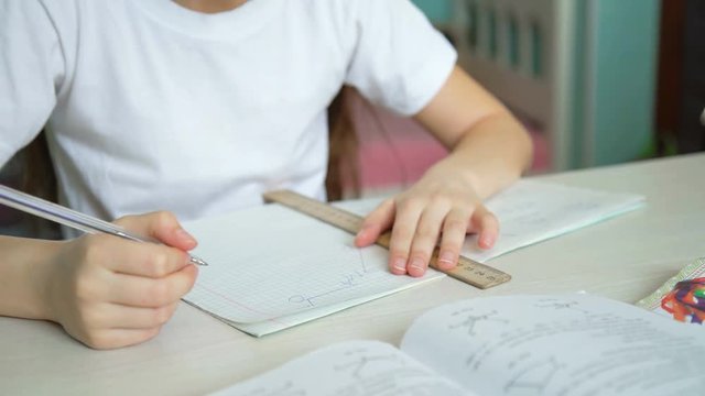 schoolgirl learning homework. pleased pupil studying mathematics