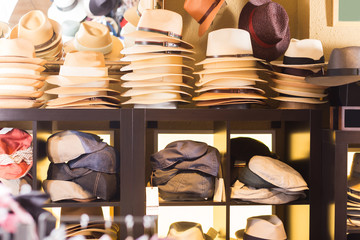 Modern sun hats hanging on the shelf