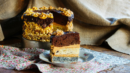 chocolate, walnuts and poppy seeds cake with butter cream 