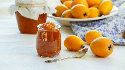 homemade loquat jam on the white background, Contre-jour light