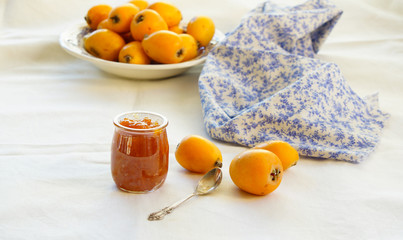 homemade loquat jam on the white background, Contre-jour light