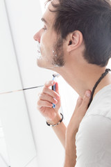 Man Shaving himself