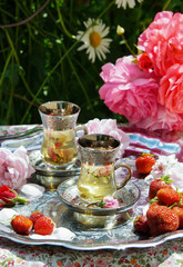 tea with rose petals, natural sunshine, outdoor 

