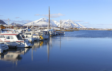 View of the marine in winter. Sailing yacht. Norwegian fjord. Natural landscape. Location: Lofoten Islands Norway.