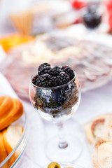 Blackberries in glass at table