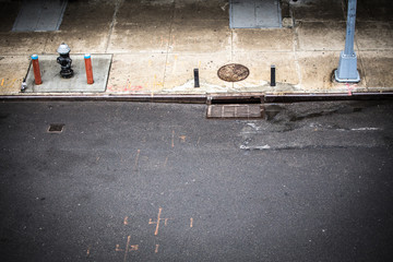 New York City, Manhattan street scene viewed from above with sidewalk, fire hydrant and manhole...