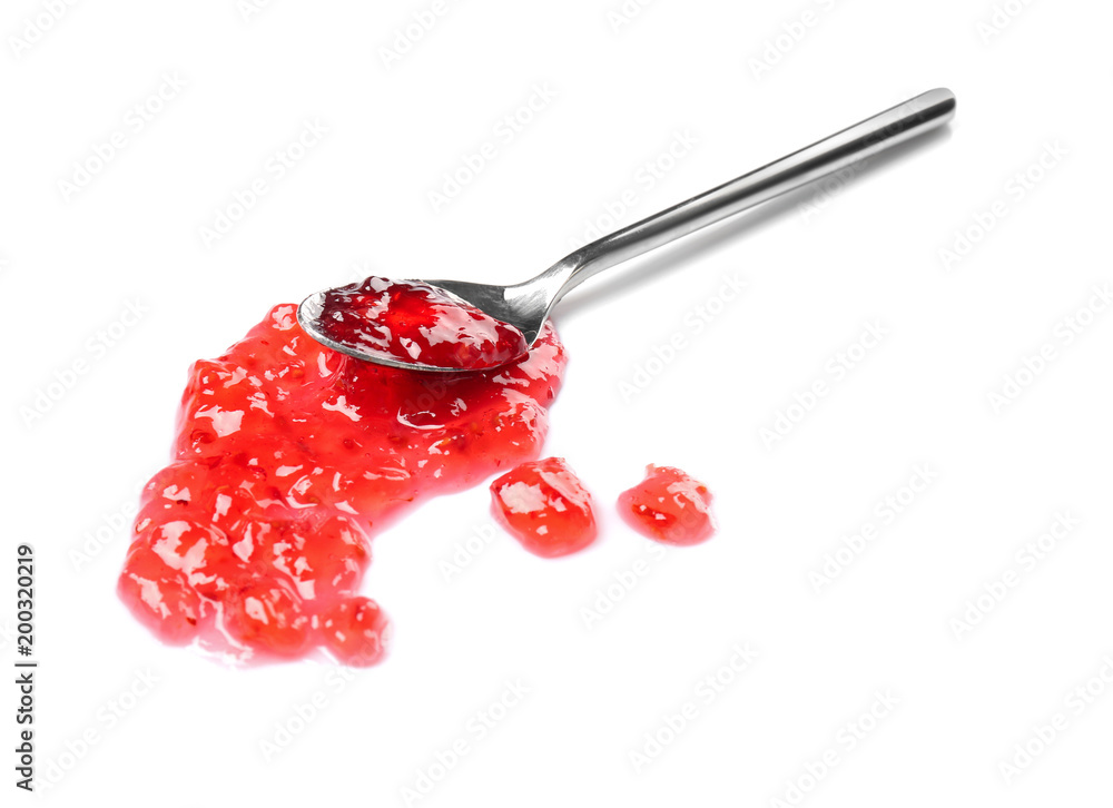 Wall mural Spoon with sweet jam on white background