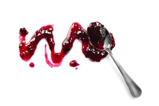 Spoon with sweet jam on white background