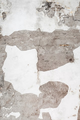 Chipped old white concrete wall texture background