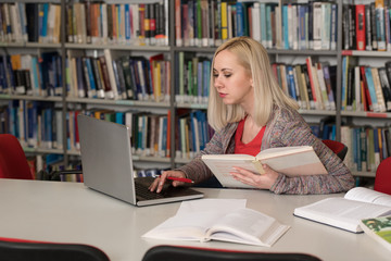 Student Using Her Laptop in a Library