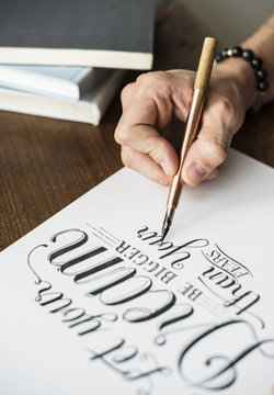 Closeup of a calligrapher working on a project