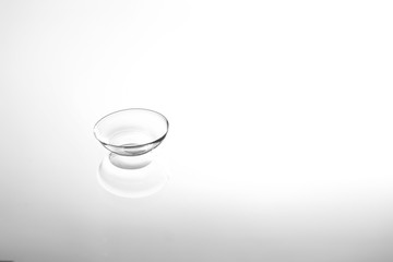 Contact lens on glass background