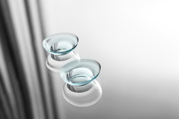 Contact lenses on glass background