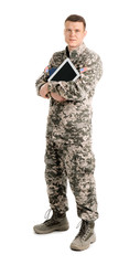Male soldier with books and tablet computer on white background. Military service