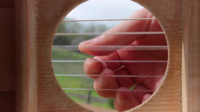 Playing acoustic guitar