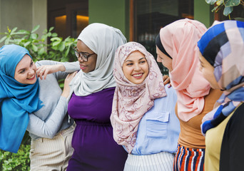 Group of islamic friends arms around and smiling together