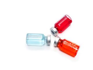 Blue, Red, Orange medicine vials glass bottle on white with text copy space ,medical medicine concept