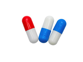 Red, white, blue medicine capsules isolated on white background. healthy medical product concept.