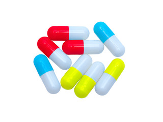 colorful red, blue, yellow, white medical Capsule pills closeup and isolated on white background. healthy medical product concept.
