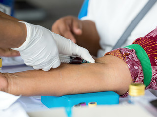 Nurse taking blood sample from patient for run blood test checking up for diabetic, Triglyceride,...