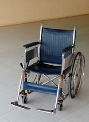Dirty old wheelchair in hospital.
