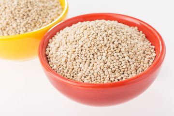 Quinoa grains in bowl isolated on white background, Chenopodium quinoa